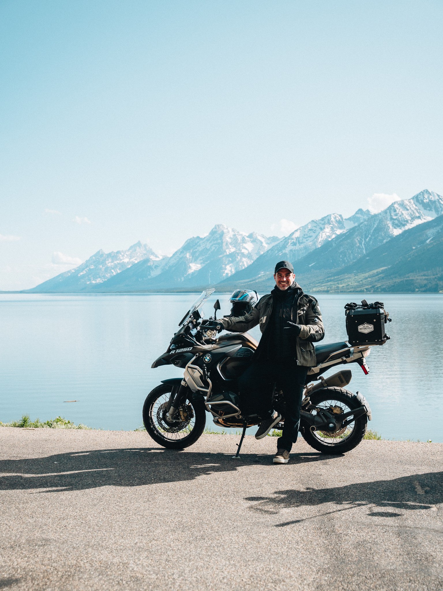 Rider with a BMW GS overlooking Grand Teton and the lake