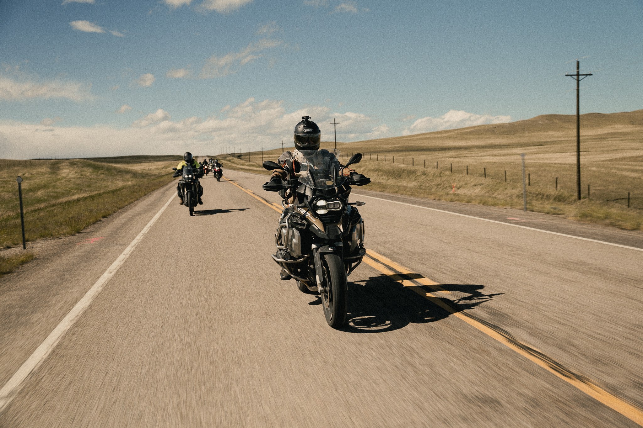 Guided group of riders on an open highway