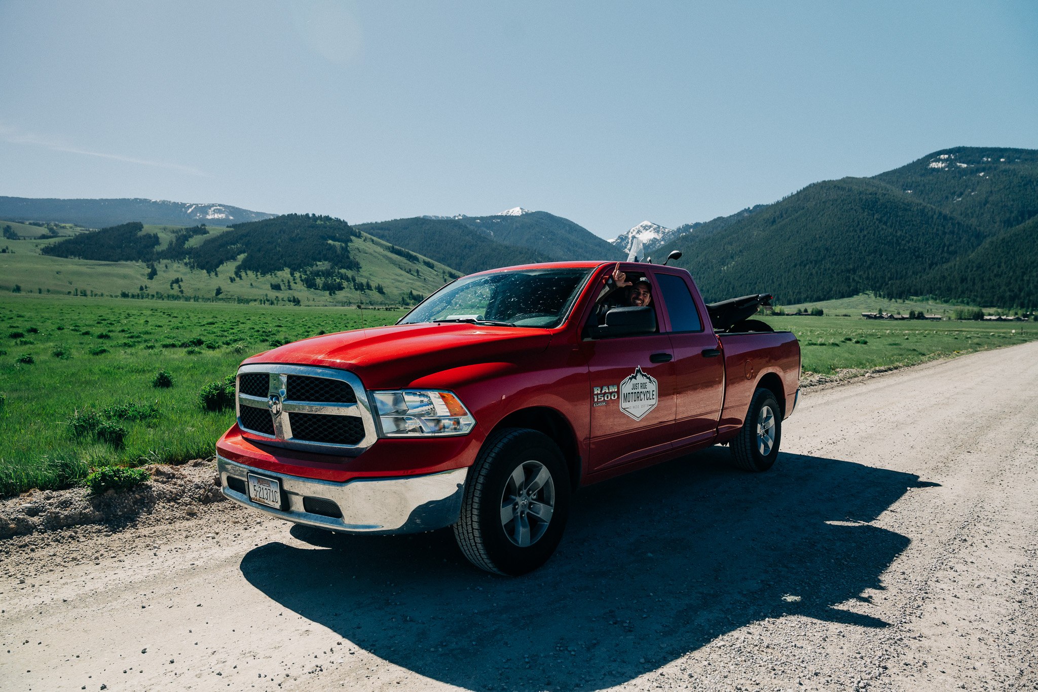 Just Ride support truck parked on a mountain road