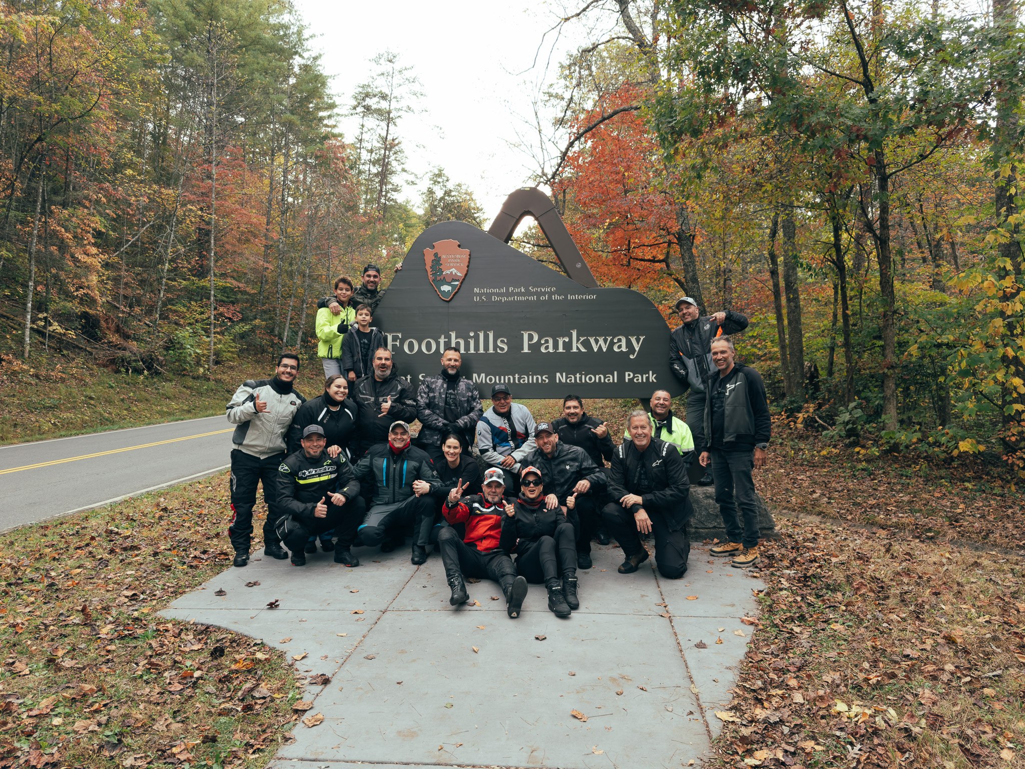 Group at the Great Smoky Mountains National Park sign in fall