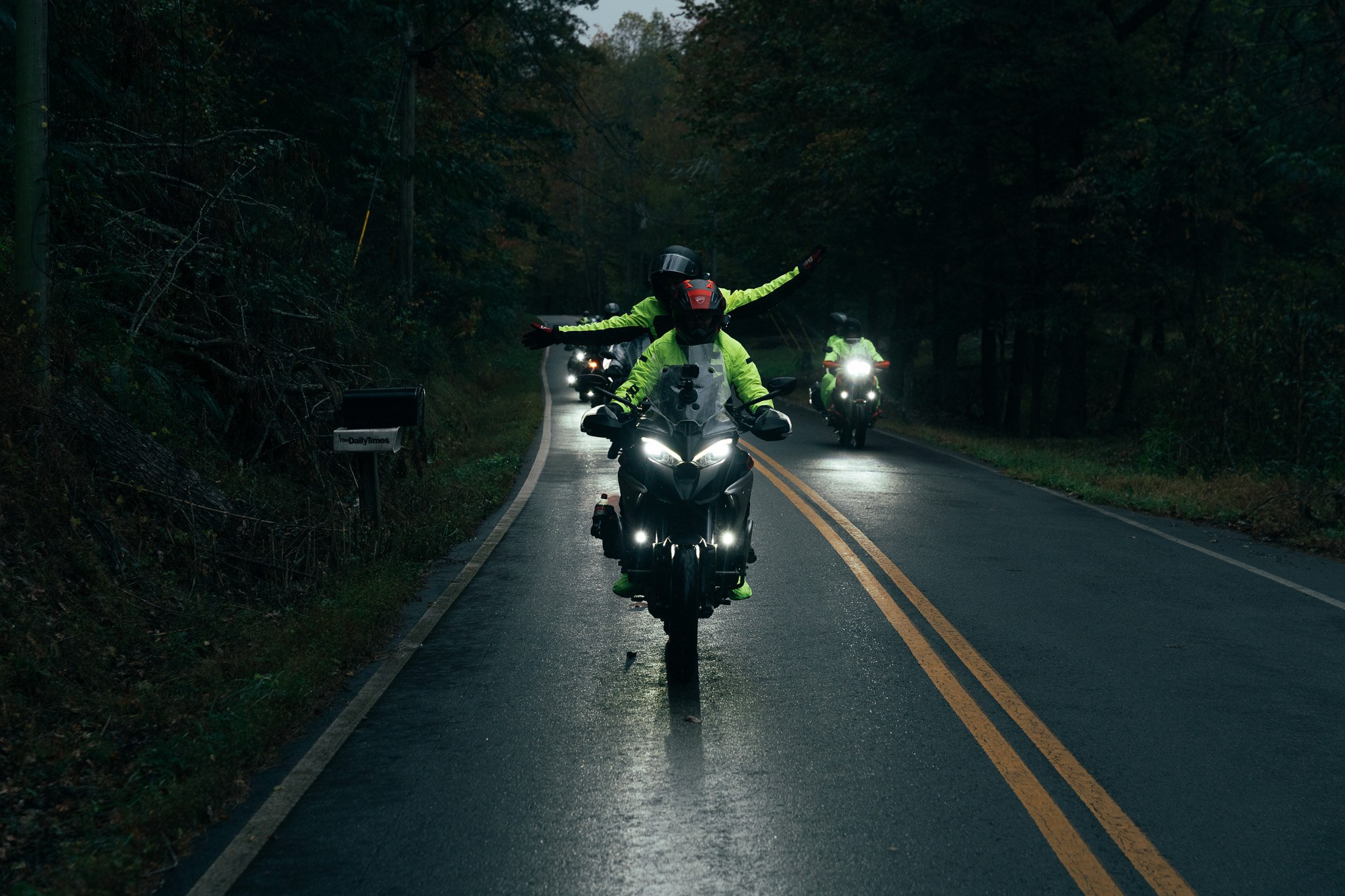 Rider on a misty forest road at dusk