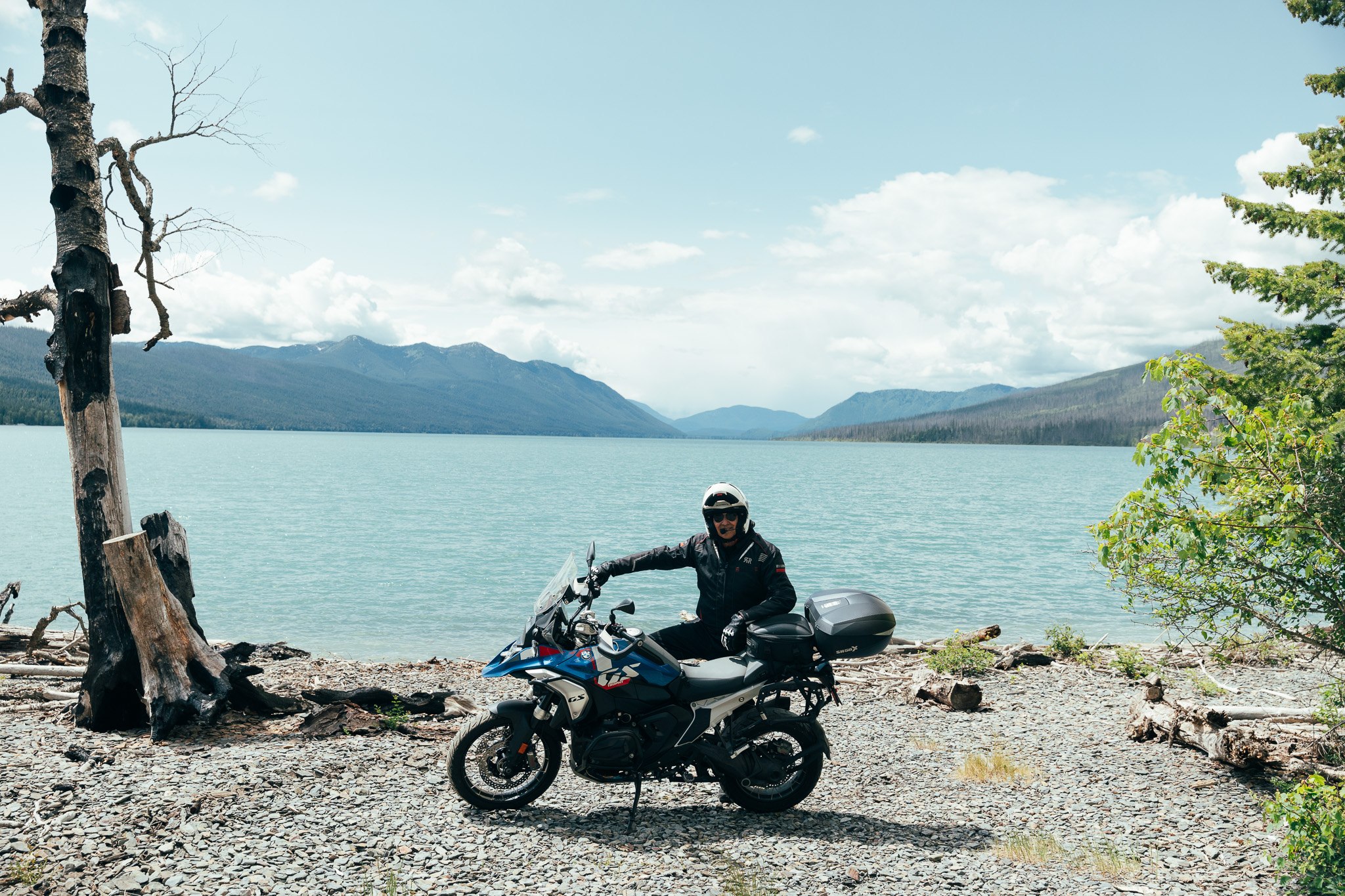 Rider with a BMW GS on a mountain lakeshore
