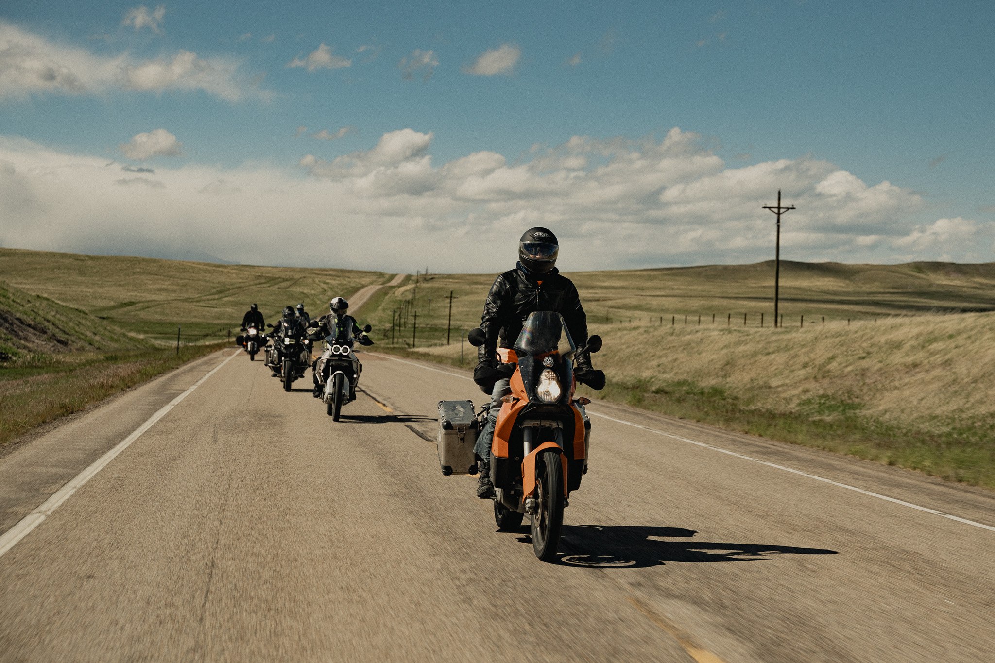 Group of riders on the open highway, Wild West Loop