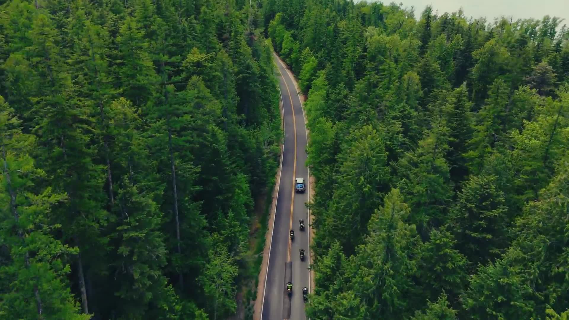 Aerial drone footage of a Just Ride group with support truck
